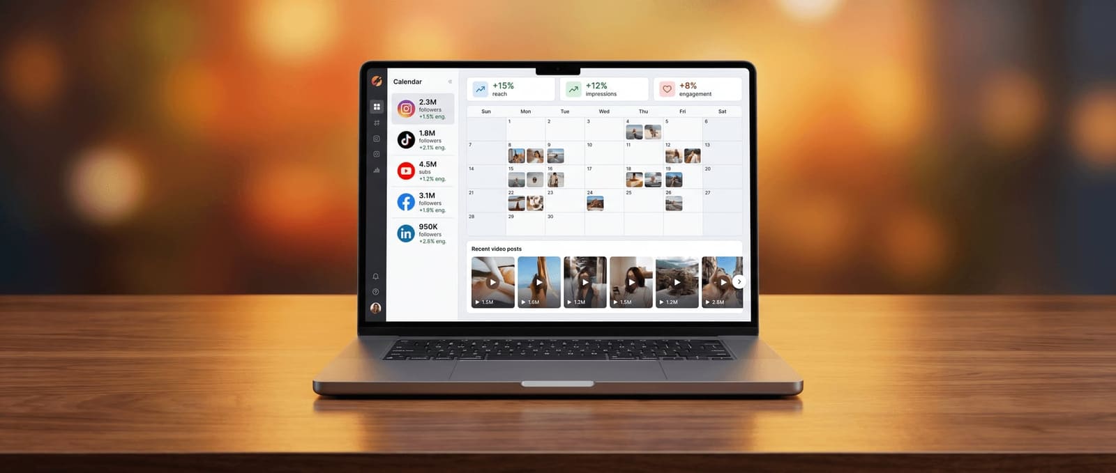 Laptop showing a multi-platform social media scheduling and analytics dashboard with a content calendar grid and platform-by-platform engagement metrics
