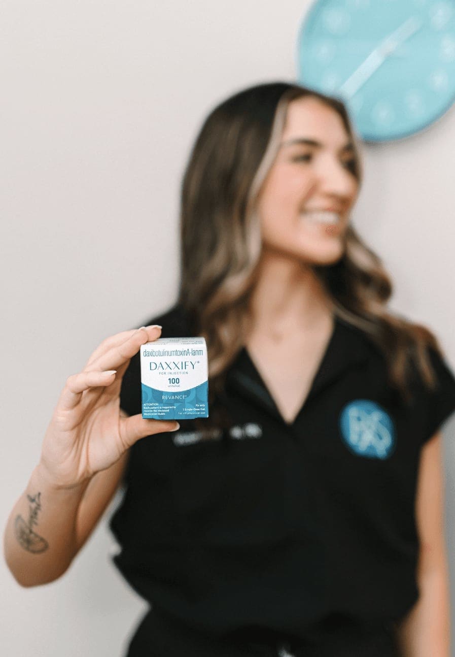 RSA staff member holding DAXXIFY — product photography from the shoot