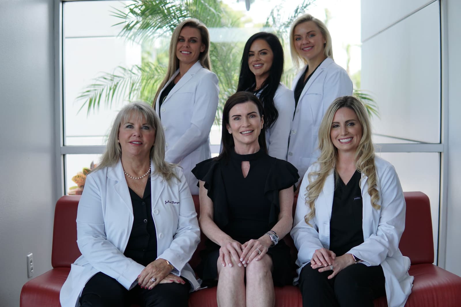 Sarasota Plastic Surgery Center staff &mdash; seated team portrait